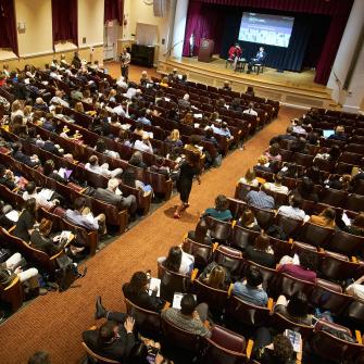 Scientist Addresses a Crowded Lecture Hall