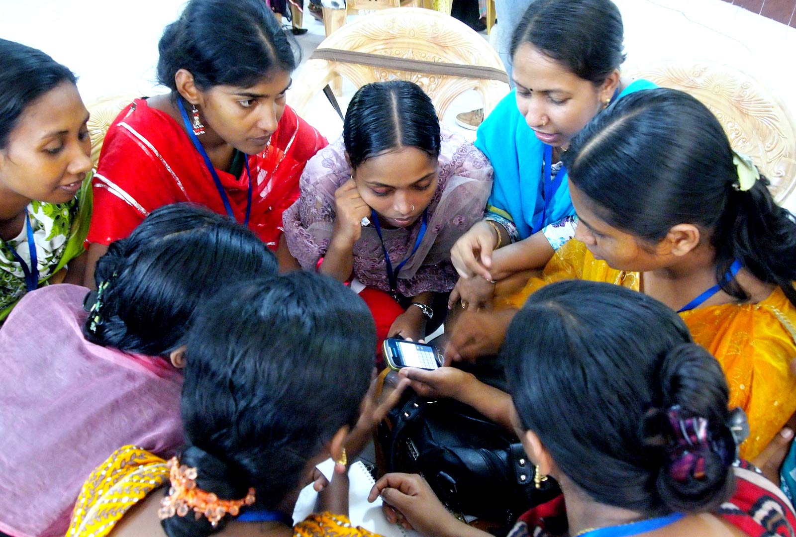 A Healthcare Worker Shows Women a Smartphone Application