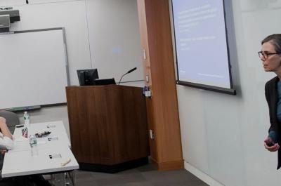 Professor Gives Powerpoint Presentation to Class