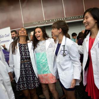 NYU School of Medicine Students Smiling at White Coat Ceremony