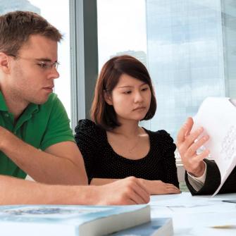 Dr. Adrian Erlebacher and Researchers in Conference Room