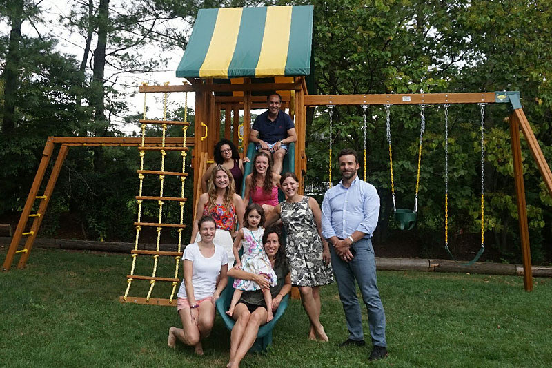 Lab Members Posing Near Swingset at 2016 Retreat