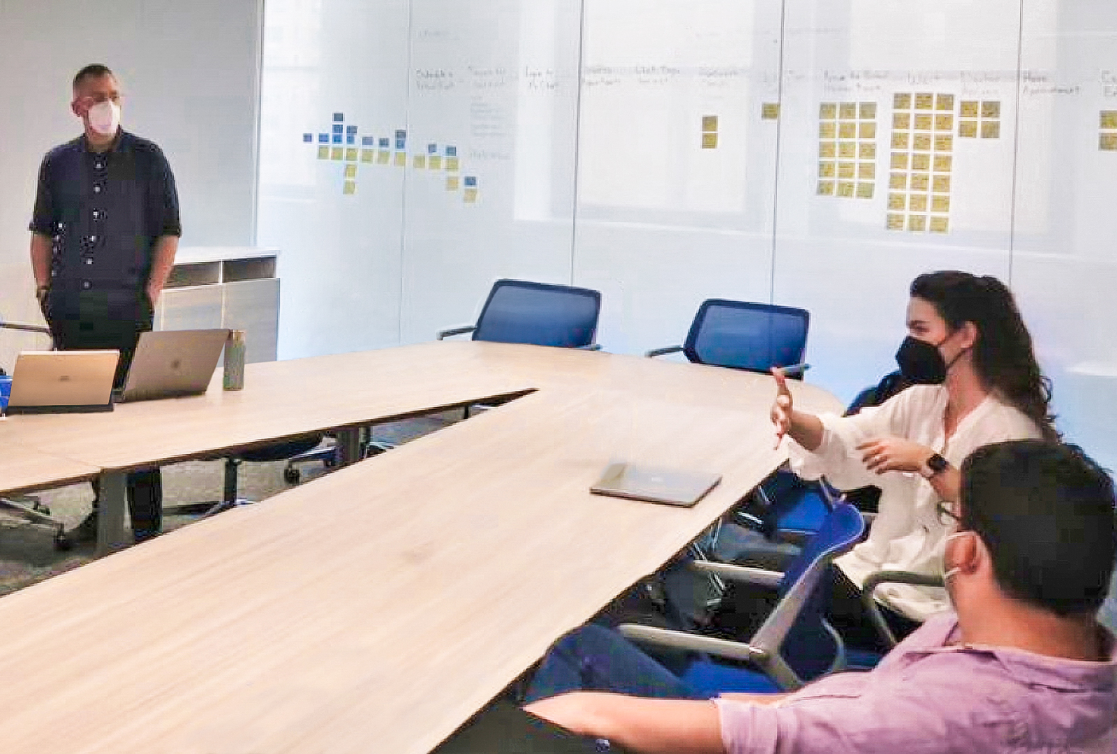 FuturePractice Team Members Converse Around a Conference Table