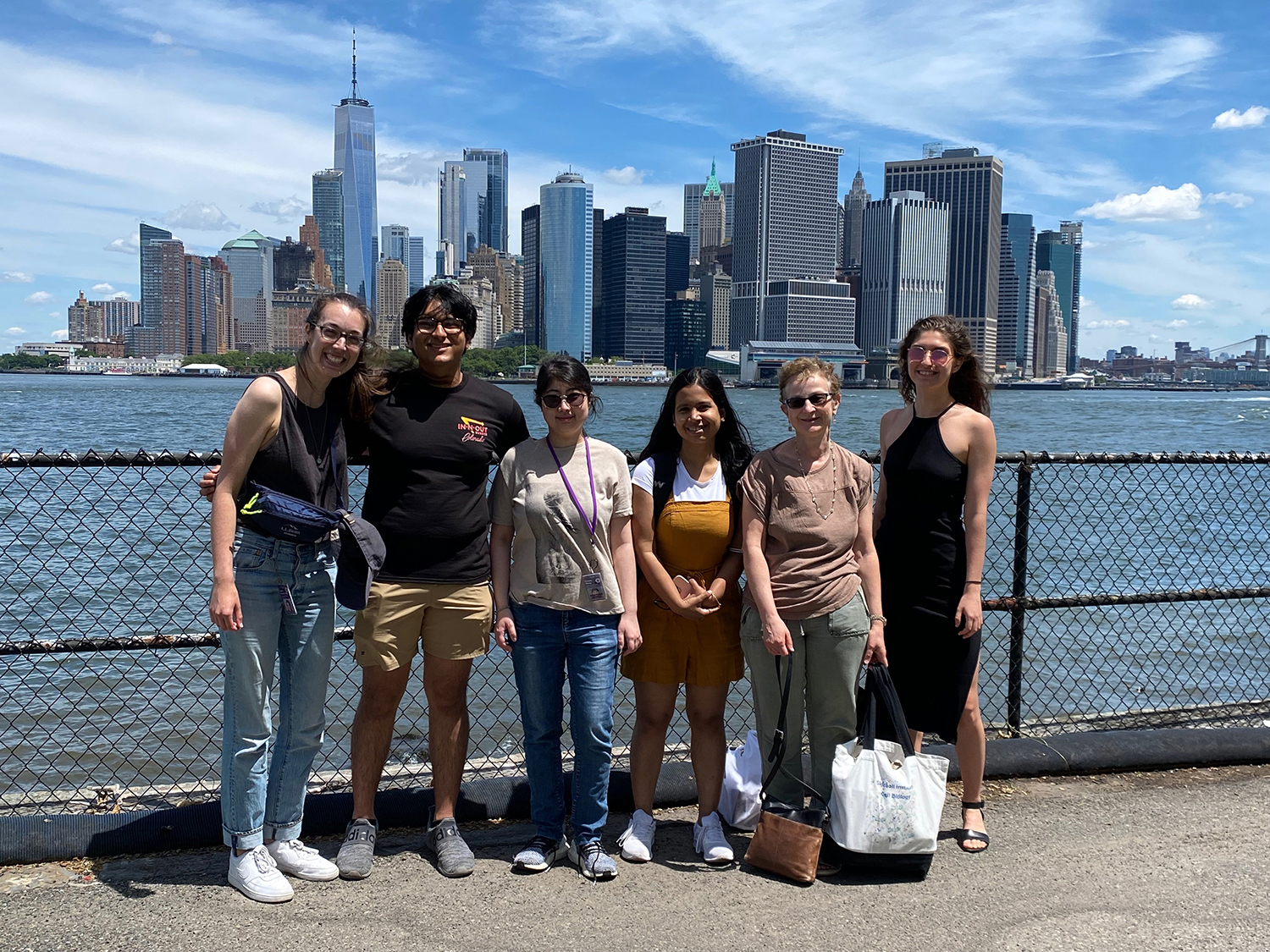 Members of the Treisman Lab Pose in Front of the City Skyline