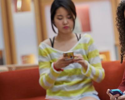 Medical Students on Phones in Medical Library