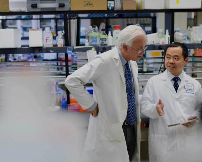 Dr. Martin Blaser and Colleague Speaking in Lab