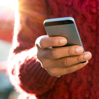 Hand Holding Mobile Phone