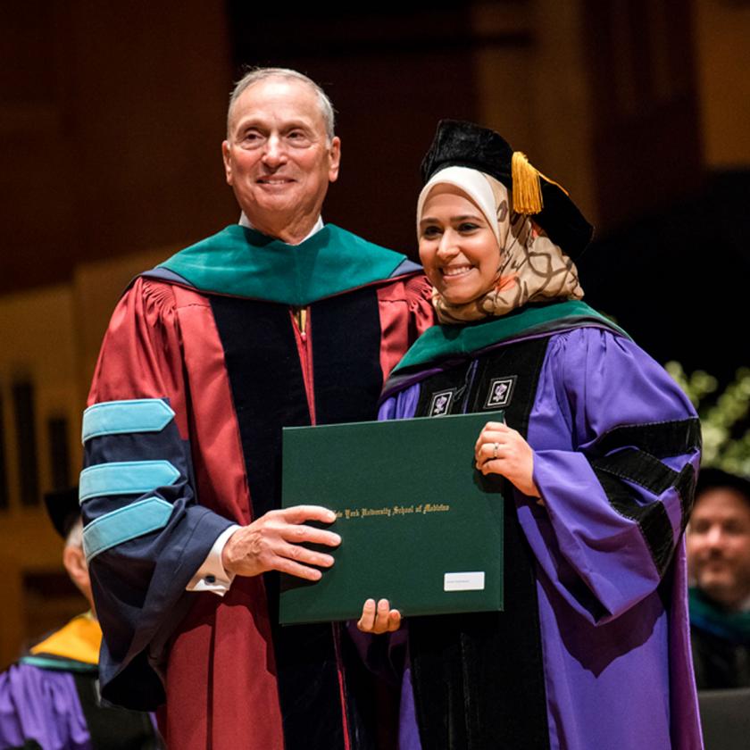 Student with faculty at NYU School of Medicine Graduation Ceremony