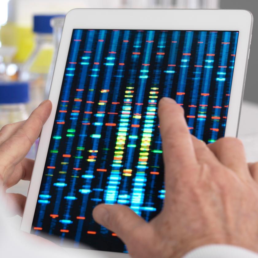 Hand Holding DNA Sequencing Results